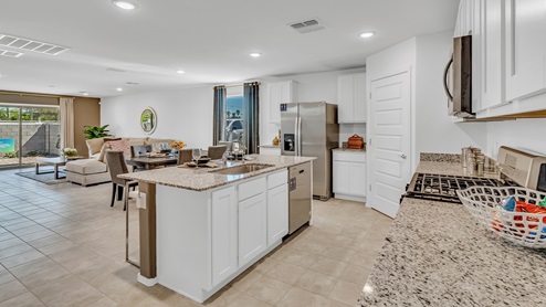 Welcome to Senita Crossing, a premier new home community by D.R. Horton, located in Tucson’s thriving southeast side. These thoughtfully crafted 3- and 4-bedroom new homes range from 1,200 to 2,200 square feet, providing the perfect blend of comfort and modern design. With easy access to I-10, Senita Crossing is conveniently situated near Davis-Monthan Air Force Base, the University of Arizona, and major employers like Raytheon, making it an ideal choice for families and professionals alike.  Each new home in Senita Crossing is designed with spacious living in mind, offering large, fully fenced backyards, covered patios, and inviting front porches. Inside, you’ll find elegant 12”x12” ceramic tile flooring throughout most areas, complemented by granite countertops and stylish Shaker cabinetry. Modern conveniences include stainless steel appliances such as a gas range, microwave, and dishwasher, all designed to enhance your daily living experience. Additionally, the Home is Connected® Smart Home package, which includes a smart thermostat, video doorbell, keyless entry, and more ensures that your home is as functional as it is beautiful.  Energy efficiency is a cornerstone of Senita Crossing’s new homes, which are DOE Zero Energy Ready. These homes feature tankless water heaters, LED lighting, and advanced spray foam insulation to ensure lower energy costs and a smaller carbon footprint, offering you a sustainable and cost-effective living environment. The community itself is designed with families in mind, featuring a park with a playground, a ramada, and a grassy common area, as well as a maintained bike and walking trail that connects to McCain Loop, providing ample opportunities for outdoor recreation.  Senita Crossing is located within the highly regarded Sunnyside Unified School District, offering access to top-rated schools such as Los Niños Elementary, Lauffer Middle School, and Desert View High School. For those seeking specialized education, the nearby Gallego Primary Fine Arts Magnet School is an excellent option for families. The community’s prime location ensures that you are never far from the essentials. With I-10 nearby, commuting is a breeze, and Tucson International Airport is just minutes away. Residents will also enjoy convenient access to shopping centers, local Carnecerias, and dining in some of the best restaurants in Tucson.  For those who appreciate outdoor activities and cultural attractions, Senita Crossing is just a short drive from Sabino Canyon, Reid Park Zoo, Tucson Botanical Gardens, and Kino Sports Complex. At Senita Crossing, D.R. Horton’s commitment to quality and innovative design is evident in every detail. Discover your ideal home in a community that offers everything you need to live your best life.