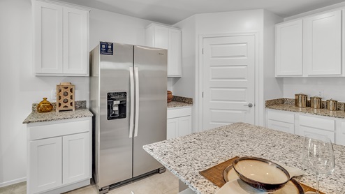 Welcome to Senita Crossing, a premier new home community by D.R. Horton, located in Tucson’s thriving southeast side. These thoughtfully crafted 3- and 4-bedroom new homes range from 1,200 to 2,200 square feet, providing the perfect blend of comfort and modern design. With easy access to I-10, Senita Crossing is conveniently situated near Davis-Monthan Air Force Base, the University of Arizona, and major employers like Raytheon, making it an ideal choice for families and professionals alike.  Each new home in Senita Crossing is designed with spacious living in mind, offering large, fully fenced backyards, covered patios, and inviting front porches. Inside, you’ll find elegant 12”x12” ceramic tile flooring throughout most areas, complemented by granite countertops and stylish Shaker cabinetry. Modern conveniences include stainless steel appliances such as a gas range, microwave, and dishwasher, all designed to enhance your daily living experience. Additionally, the Home is Connected® Smart Home package, which includes a smart thermostat, video doorbell, keyless entry, and more ensures that your home is as functional as it is beautiful.  Energy efficiency is a cornerstone of Senita Crossing’s new homes, which are DOE Zero Energy Ready. These homes feature tankless water heaters, LED lighting, and advanced spray foam insulation to ensure lower energy costs and a smaller carbon footprint, offering you a sustainable and cost-effective living environment. The community itself is designed with families in mind, featuring a park with a playground, a ramada, and a grassy common area, as well as a maintained bike and walking trail that connects to McCain Loop, providing ample opportunities for outdoor recreation.  Senita Crossing is located within the highly regarded Sunnyside Unified School District, offering access to top-rated schools such as Los Niños Elementary, Lauffer Middle School, and Desert View High School. For those seeking specialized education, the nearby Gallego Primary Fine Arts Magnet School is an excellent option for families. The community’s prime location ensures that you are never far from the essentials. With I-10 nearby, commuting is a breeze, and Tucson International Airport is just minutes away. Residents will also enjoy convenient access to shopping centers, local Carnecerias, and dining in some of the best restaurants in Tucson.  For those who appreciate outdoor activities and cultural attractions, Senita Crossing is just a short drive from Sabino Canyon, Reid Park Zoo, Tucson Botanical Gardens, and Kino Sports Complex. At Senita Crossing, D.R. Horton’s commitment to quality and innovative design is evident in every detail. Discover your ideal home in a community that offers everything you need to live your best life.