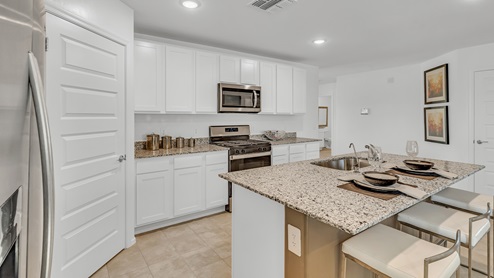 Welcome to Senita Crossing, a premier new home community by D.R. Horton, located in Tucson’s thriving southeast side. These thoughtfully crafted 3- and 4-bedroom new homes range from 1,200 to 2,200 square feet, providing the perfect blend of comfort and modern design. With easy access to I-10, Senita Crossing is conveniently situated near Davis-Monthan Air Force Base, the University of Arizona, and major employers like Raytheon, making it an ideal choice for families and professionals alike.  Each new home in Senita Crossing is designed with spacious living in mind, offering large, fully fenced backyards, covered patios, and inviting front porches. Inside, you’ll find elegant 12”x12” ceramic tile flooring throughout most areas, complemented by granite countertops and stylish Shaker cabinetry. Modern conveniences include stainless steel appliances such as a gas range, microwave, and dishwasher, all designed to enhance your daily living experience. Additionally, the Home is Connected® Smart Home package, which includes a smart thermostat, video doorbell, keyless entry, and more ensures that your home is as functional as it is beautiful.  Energy efficiency is a cornerstone of Senita Crossing’s new homes, which are DOE Zero Energy Ready. These homes feature tankless water heaters, LED lighting, and advanced spray foam insulation to ensure lower energy costs and a smaller carbon footprint, offering you a sustainable and cost-effective living environment. The community itself is designed with families in mind, featuring a park with a playground, a ramada, and a grassy common area, as well as a maintained bike and walking trail that connects to McCain Loop, providing ample opportunities for outdoor recreation.  Senita Crossing is located within the highly regarded Sunnyside Unified School District, offering access to top-rated schools such as Los Niños Elementary, Lauffer Middle School, and Desert View High School. For those seeking specialized education, the nearby Gallego Primary Fine Arts Magnet School is an excellent option for families. The community’s prime location ensures that you are never far from the essentials. With I-10 nearby, commuting is a breeze, and Tucson International Airport is just minutes away. Residents will also enjoy convenient access to shopping centers, local Carnecerias, and dining in some of the best restaurants in Tucson.  For those who appreciate outdoor activities and cultural attractions, Senita Crossing is just a short drive from Sabino Canyon, Reid Park Zoo, Tucson Botanical Gardens, and Kino Sports Complex. At Senita Crossing, D.R. Horton’s commitment to quality and innovative design is evident in every detail. Discover your ideal home in a community that offers everything you need to live your best life.