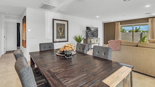 Welcome to Senita Crossing, a premier new home community by D.R. Horton, located in Tucson’s thriving southeast side. These thoughtfully crafted 3- and 4-bedroom new homes range from 1,200 to 2,200 square feet, providing the perfect blend of comfort and modern design. With easy access to I-10, Senita Crossing is conveniently situated near Davis-Monthan Air Force Base, the University of Arizona, and major employers like Raytheon, making it an ideal choice for families and professionals alike.  Each new home in Senita Crossing is designed with spacious living in mind, offering large, fully fenced backyards, covered patios, and inviting front porches. Inside, you’ll find elegant 12”x12” ceramic tile flooring throughout most areas, complemented by granite countertops and stylish Shaker cabinetry. Modern conveniences include stainless steel appliances such as a gas range, microwave, and dishwasher, all designed to enhance your daily living experience. Additionally, the Home is Connected® Smart Home package, which includes a smart thermostat, video doorbell, keyless entry, and more ensures that your home is as functional as it is beautiful.  Energy efficiency is a cornerstone of Senita Crossing’s new homes, which are DOE Zero Energy Ready. These homes feature tankless water heaters, LED lighting, and advanced spray foam insulation to ensure lower energy costs and a smaller carbon footprint, offering you a sustainable and cost-effective living environment. The community itself is designed with families in mind, featuring a park with a playground, a ramada, and a grassy common area, as well as a maintained bike and walking trail that connects to McCain Loop, providing ample opportunities for outdoor recreation.  Senita Crossing is located within the highly regarded Sunnyside Unified School District, offering access to top-rated schools such as Los Niños Elementary, Lauffer Middle School, and Desert View High School. For those seeking specialized education, the nearby Gallego Primary Fine Arts Magnet School is an excellent option for families. The community’s prime location ensures that you are never far from the essentials. With I-10 nearby, commuting is a breeze, and Tucson International Airport is just minutes away. Residents will also enjoy convenient access to shopping centers, local Carnecerias, and dining in some of the best restaurants in Tucson.  For those who appreciate outdoor activities and cultural attractions, Senita Crossing is just a short drive from Sabino Canyon, Reid Park Zoo, Tucson Botanical Gardens, and Kino Sports Complex. At Senita Crossing, D.R. Horton’s commitment to quality and innovative design is evident in every detail. Discover your ideal home in a community that offers everything you need to live your best life.