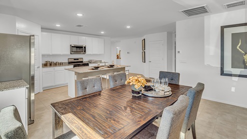 Welcome to Senita Crossing, a premier new home community by D.R. Horton, located in Tucson’s thriving southeast side. These thoughtfully crafted 3- and 4-bedroom new homes range from 1,200 to 2,200 square feet, providing the perfect blend of comfort and modern design. With easy access to I-10, Senita Crossing is conveniently situated near Davis-Monthan Air Force Base, the University of Arizona, and major employers like Raytheon, making it an ideal choice for families and professionals alike.  Each new home in Senita Crossing is designed with spacious living in mind, offering large, fully fenced backyards, covered patios, and inviting front porches. Inside, you’ll find elegant 12”x12” ceramic tile flooring throughout most areas, complemented by granite countertops and stylish Shaker cabinetry. Modern conveniences include stainless steel appliances such as a gas range, microwave, and dishwasher, all designed to enhance your daily living experience. Additionally, the Home is Connected® Smart Home package, which includes a smart thermostat, video doorbell, keyless entry, and more ensures that your home is as functional as it is beautiful.  Energy efficiency is a cornerstone of Senita Crossing’s new homes, which are DOE Zero Energy Ready. These homes feature tankless water heaters, LED lighting, and advanced spray foam insulation to ensure lower energy costs and a smaller carbon footprint, offering you a sustainable and cost-effective living environment. The community itself is designed with families in mind, featuring a park with a playground, a ramada, and a grassy common area, as well as a maintained bike and walking trail that connects to McCain Loop, providing ample opportunities for outdoor recreation.  Senita Crossing is located within the highly regarded Sunnyside Unified School District, offering access to top-rated schools such as Los Niños Elementary, Lauffer Middle School, and Desert View High School. For those seeking specialized education, the nearby Gallego Primary Fine Arts Magnet School is an excellent option for families. The community’s prime location ensures that you are never far from the essentials. With I-10 nearby, commuting is a breeze, and Tucson International Airport is just minutes away. Residents will also enjoy convenient access to shopping centers, local Carnecerias, and dining in some of the best restaurants in Tucson.  For those who appreciate outdoor activities and cultural attractions, Senita Crossing is just a short drive from Sabino Canyon, Reid Park Zoo, Tucson Botanical Gardens, and Kino Sports Complex. At Senita Crossing, D.R. Horton’s commitment to quality and innovative design is evident in every detail. Discover your ideal home in a community that offers everything you need to live your best life.