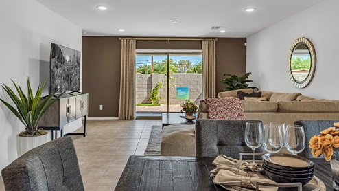 Welcome to Senita Crossing, a premier new home community by D.R. Horton, located in Tucson’s thriving southeast side. These thoughtfully crafted 3- and 4-bedroom new homes range from 1,200 to 2,200 square feet, providing the perfect blend of comfort and modern design. With easy access to I-10, Senita Crossing is conveniently situated near Davis-Monthan Air Force Base, the University of Arizona, and major employers like Raytheon, making it an ideal choice for families and professionals alike.  Each new home in Senita Crossing is designed with spacious living in mind, offering large, fully fenced backyards, covered patios, and inviting front porches. Inside, you’ll find elegant 12”x12” ceramic tile flooring throughout most areas, complemented by granite countertops and stylish Shaker cabinetry. Modern conveniences include stainless steel appliances such as a gas range, microwave, and dishwasher, all designed to enhance your daily living experience. Additionally, the Home is Connected® Smart Home package, which includes a smart thermostat, video doorbell, keyless entry, and more ensures that your home is as functional as it is beautiful.  Energy efficiency is a cornerstone of Senita Crossing’s new homes, which are DOE Zero Energy Ready. These homes feature tankless water heaters, LED lighting, and advanced spray foam insulation to ensure lower energy costs and a smaller carbon footprint, offering you a sustainable and cost-effective living environment. The community itself is designed with families in mind, featuring a park with a playground, a ramada, and a grassy common area, as well as a maintained bike and walking trail that connects to McCain Loop, providing ample opportunities for outdoor recreation.  Senita Crossing is located within the highly regarded Sunnyside Unified School District, offering access to top-rated schools such as Los Niños Elementary, Lauffer Middle School, and Desert View High School. For those seeking specialized education, the nearby Gallego Primary Fine Arts Magnet School is an excellent option for families. The community’s prime location ensures that you are never far from the essentials. With I-10 nearby, commuting is a breeze, and Tucson International Airport is just minutes away. Residents will also enjoy convenient access to shopping centers, local Carnecerias, and dining in some of the best restaurants in Tucson.  For those who appreciate outdoor activities and cultural attractions, Senita Crossing is just a short drive from Sabino Canyon, Reid Park Zoo, Tucson Botanical Gardens, and Kino Sports Complex. At Senita Crossing, D.R. Horton’s commitment to quality and innovative design is evident in every detail. Discover your ideal home in a community that offers everything you need to live your best life.