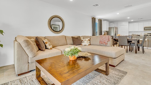 Welcome to Senita Crossing, a premier new home community by D.R. Horton, located in Tucson’s thriving southeast side. These thoughtfully crafted 3- and 4-bedroom new homes range from 1,200 to 2,200 square feet, providing the perfect blend of comfort and modern design. With easy access to I-10, Senita Crossing is conveniently situated near Davis-Monthan Air Force Base, the University of Arizona, and major employers like Raytheon, making it an ideal choice for families and professionals alike.  Each new home in Senita Crossing is designed with spacious living in mind, offering large, fully fenced backyards, covered patios, and inviting front porches. Inside, you’ll find elegant 12”x12” ceramic tile flooring throughout most areas, complemented by granite countertops and stylish Shaker cabinetry. Modern conveniences include stainless steel appliances such as a gas range, microwave, and dishwasher, all designed to enhance your daily living experience. Additionally, the Home is Connected® Smart Home package, which includes a smart thermostat, video doorbell, keyless entry, and more ensures that your home is as functional as it is beautiful.  Energy efficiency is a cornerstone of Senita Crossing’s new homes, which are DOE Zero Energy Ready. These homes feature tankless water heaters, LED lighting, and advanced spray foam insulation to ensure lower energy costs and a smaller carbon footprint, offering you a sustainable and cost-effective living environment. The community itself is designed with families in mind, featuring a park with a playground, a ramada, and a grassy common area, as well as a maintained bike and walking trail that connects to McCain Loop, providing ample opportunities for outdoor recreation.  Senita Crossing is located within the highly regarded Sunnyside Unified School District, offering access to top-rated schools such as Los Niños Elementary, Lauffer Middle School, and Desert View High School. For those seeking specialized education, the nearby Gallego Primary Fine Arts Magnet School is an excellent option for families. The community’s prime location ensures that you are never far from the essentials. With I-10 nearby, commuting is a breeze, and Tucson International Airport is just minutes away. Residents will also enjoy convenient access to shopping centers, local Carnecerias, and dining in some of the best restaurants in Tucson.  For those who appreciate outdoor activities and cultural attractions, Senita Crossing is just a short drive from Sabino Canyon, Reid Park Zoo, Tucson Botanical Gardens, and Kino Sports Complex. At Senita Crossing, D.R. Horton’s commitment to quality and innovative design is evident in every detail. Discover your ideal home in a community that offers everything you need to live your best life.