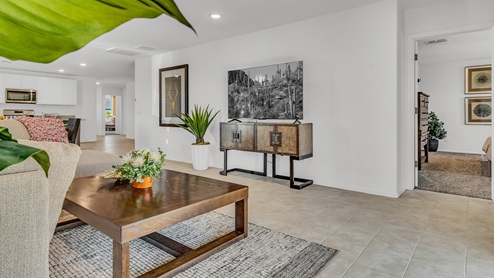 Welcome to Senita Crossing, a premier new home community by D.R. Horton, located in Tucson’s thriving southeast side. These thoughtfully crafted 3- and 4-bedroom new homes range from 1,200 to 2,200 square feet, providing the perfect blend of comfort and modern design. With easy access to I-10, Senita Crossing is conveniently situated near Davis-Monthan Air Force Base, the University of Arizona, and major employers like Raytheon, making it an ideal choice for families and professionals alike.  Each new home in Senita Crossing is designed with spacious living in mind, offering large, fully fenced backyards, covered patios, and inviting front porches. Inside, you’ll find elegant 12”x12” ceramic tile flooring throughout most areas, complemented by granite countertops and stylish Shaker cabinetry. Modern conveniences include stainless steel appliances such as a gas range, microwave, and dishwasher, all designed to enhance your daily living experience. Additionally, the Home is Connected® Smart Home package, which includes a smart thermostat, video doorbell, keyless entry, and more ensures that your home is as functional as it is beautiful.  Energy efficiency is a cornerstone of Senita Crossing’s new homes, which are DOE Zero Energy Ready. These homes feature tankless water heaters, LED lighting, and advanced spray foam insulation to ensure lower energy costs and a smaller carbon footprint, offering you a sustainable and cost-effective living environment. The community itself is designed with families in mind, featuring a park with a playground, a ramada, and a grassy common area, as well as a maintained bike and walking trail that connects to McCain Loop, providing ample opportunities for outdoor recreation.  Senita Crossing is located within the highly regarded Sunnyside Unified School District, offering access to top-rated schools such as Los Niños Elementary, Lauffer Middle School, and Desert View High School. For those seeking specialized education, the nearby Gallego Primary Fine Arts Magnet School is an excellent option for families. The community’s prime location ensures that you are never far from the essentials. With I-10 nearby, commuting is a breeze, and Tucson International Airport is just minutes away. Residents will also enjoy convenient access to shopping centers, local Carnecerias, and dining in some of the best restaurants in Tucson.  For those who appreciate outdoor activities and cultural attractions, Senita Crossing is just a short drive from Sabino Canyon, Reid Park Zoo, Tucson Botanical Gardens, and Kino Sports Complex. At Senita Crossing, D.R. Horton’s commitment to quality and innovative design is evident in every detail. Discover your ideal home in a community that offers everything you need to live your best life.