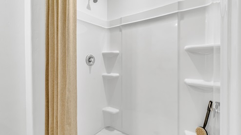 Welcome to Senita Crossing, a premier new home community by D.R. Horton, located in Tucson’s thriving southeast side. These thoughtfully crafted 3- and 4-bedroom new homes range from 1,200 to 2,200 square feet, providing the perfect blend of comfort and modern design. With easy access to I-10, Senita Crossing is conveniently situated near Davis-Monthan Air Force Base, the University of Arizona, and major employers like Raytheon, making it an ideal choice for families and professionals alike.  Each new home in Senita Crossing is designed with spacious living in mind, offering large, fully fenced backyards, covered patios, and inviting front porches. Inside, you’ll find elegant 12”x12” ceramic tile flooring throughout most areas, complemented by granite countertops and stylish Shaker cabinetry. Modern conveniences include stainless steel appliances such as a gas range, microwave, and dishwasher, all designed to enhance your daily living experience. Additionally, the Home is Connected® Smart Home package, which includes a smart thermostat, video doorbell, keyless entry, and more ensures that your home is as functional as it is beautiful.  Energy efficiency is a cornerstone of Senita Crossing’s new homes, which are DOE Zero Energy Ready. These homes feature tankless water heaters, LED lighting, and advanced spray foam insulation to ensure lower energy costs and a smaller carbon footprint, offering you a sustainable and cost-effective living environment. The community itself is designed with families in mind, featuring a park with a playground, a ramada, and a grassy common area, as well as a maintained bike and walking trail that connects to McCain Loop, providing ample opportunities for outdoor recreation.  Senita Crossing is located within the highly regarded Sunnyside Unified School District, offering access to top-rated schools such as Los Niños Elementary, Lauffer Middle School, and Desert View High School. For those seeking specialized education, the nearby Gallego Primary Fine Arts Magnet School is an excellent option for families. The community’s prime location ensures that you are never far from the essentials. With I-10 nearby, commuting is a breeze, and Tucson International Airport is just minutes away. Residents will also enjoy convenient access to shopping centers, local Carnecerias, and dining in some of the best restaurants in Tucson.  For those who appreciate outdoor activities and cultural attractions, Senita Crossing is just a short drive from Sabino Canyon, Reid Park Zoo, Tucson Botanical Gardens, and Kino Sports Complex. At Senita Crossing, D.R. Horton’s commitment to quality and innovative design is evident in every detail. Discover your ideal home in a community that offers everything you need to live your best life.