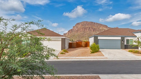 Discover the new homes at Roadrunner Estates, a serene D.R. Horton community nestled in the heart of Tucson, Arizona, where modern living meets the tranquility of nature. Situated just off Irvington Road and Camino de Oeste, this thoughtfully designed community offers an array of three-, four-, and five-bedroom homes, each crafted to provide comfort, convenience, and style. Each new home at Roadrunner Estates is equipped with an array of high-quality standard features, designed to enhance your living experience. Enjoy the benefits of professionally landscaped front and backyards with auto drip irrigation, creating a beautiful and low-maintenance outdoor space. Inside, the homes boast luxurious quartz countertops in the kitchens and bathrooms, stainless steel appliances, and wood-look flooring that brings warmth and elegance to the living spaces. With 9-foot ceilings, rounded drywall corners, hock & trowel wall texture, covered front porches and back patios, these homes are designed for both functionality and aesthetic appeal. Roadrunner Estates also includes the Home is Connected® Smart Home package, offering a suite of modern technology features such as a smart thermostat, video doorbell, keyless entry, Wi-Fi-enabled garage door opener, and energy-efficient LED lighting throughout. But what makes these homes truly special? They were meticulously finished in 2022 and exclusively rentals for a brief one-year stint. Now, we're making them available to call your forever home! This makes Roadrunner Estates Tucson's most centrally located and irresistible community. The community itself offers a tranquil and inviting atmosphere, complete with a neighborhood park, private backyards enclosed by modern rustic fencing, and stunning views of the surrounding mountains. The Spanish lace stucco exteriors add to the charm and durability of these homes, making them a lasting investment. Roadrunner Estates is ideally located at the base of Tucson Mountain Park, offering easy access to a variety of outdoor activities, including hiking and biking trails. The nearby Gates Pass Overlook is a local favorite for watching sunsets, while the Arizona-Sonora Desert Museum, Old Tucson, and San Xavier Church provide rich cultural and historical experiences. For your daily needs, the thriving Tucson Spectrum Shopping Center is just minutes away, offering a variety of shopping, dining, and entertainment options. Other nearby amenities include Casino del Sol, Manzanita Park with its pool and splash pad, and Desert Sports Fitness. The community’s proximity to Tucson International Airport, Davis-Monthan Air Force Base, and major employers makes it an ideal location for those seeking a balanced lifestyle. Experience the best of Tucson living at Roadrunner Estates, where your new home offers a perfect blend of modern convenience, aesthetic appeal, and natural beauty.