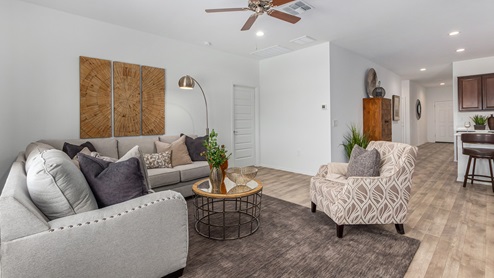 Discover the new homes at Roadrunner Estates, a serene D.R. Horton community nestled in the heart of Tucson, Arizona, where modern living meets the tranquility of nature. Situated just off Irvington Road and Camino de Oeste, this thoughtfully designed community offers an array of three-, four-, and five-bedroom homes, each crafted to provide comfort, convenience, and style. Each new home at Roadrunner Estates is equipped with an array of high-quality standard features, designed to enhance your living experience. Enjoy the benefits of professionally landscaped front and backyards with auto drip irrigation, creating a beautiful and low-maintenance outdoor space. Inside, the homes boast luxurious quartz countertops in the kitchens and bathrooms, stainless steel appliances, and wood-look flooring that brings warmth and elegance to the living spaces. With 9-foot ceilings, rounded drywall corners, hock & trowel wall texture, covered front porches and back patios, these homes are designed for both functionality and aesthetic appeal. Roadrunner Estates also includes the Home is Connected® Smart Home package, offering a suite of modern technology features such as a smart thermostat, video doorbell, keyless entry, Wi-Fi-enabled garage door opener, and energy-efficient LED lighting throughout. But what makes these homes truly special? They were meticulously finished in 2022 and exclusively rentals for a brief one-year stint. Now, we're making them available to call your forever home! This makes Roadrunner Estates Tucson's most centrally located and irresistible community. The community itself offers a tranquil and inviting atmosphere, complete with a neighborhood park, private backyards enclosed by modern rustic fencing, and stunning views of the surrounding mountains. The Spanish lace stucco exteriors add to the charm and durability of these homes, making them a lasting investment. Roadrunner Estates is ideally located at the base of Tucson Mountain Park, offering easy access to a variety of outdoor activities, including hiking and biking trails. The nearby Gates Pass Overlook is a local favorite for watching sunsets, while the Arizona-Sonora Desert Museum, Old Tucson, and San Xavier Church provide rich cultural and historical experiences. For your daily needs, the thriving Tucson Spectrum Shopping Center is just minutes away, offering a variety of shopping, dining, and entertainment options. Other nearby amenities include Casino del Sol, Manzanita Park with its pool and splash pad, and Desert Sports Fitness. The community’s proximity to Tucson International Airport, Davis-Monthan Air Force Base, and major employers makes it an ideal location for those seeking a balanced lifestyle. Experience the best of Tucson living at Roadrunner Estates, where your new home offers a perfect blend of modern convenience, aesthetic appeal, and natural beauty.