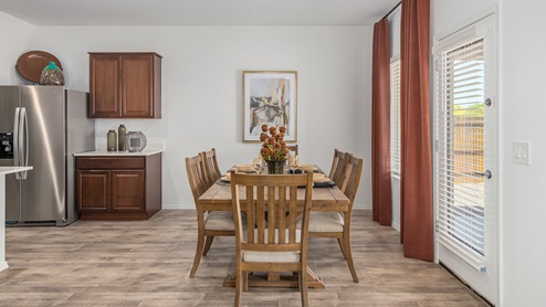 Discover the new homes at Roadrunner Estates, a serene D.R. Horton community nestled in the heart of Tucson, Arizona, where modern living meets the tranquility of nature. Situated just off Irvington Road and Camino de Oeste, this thoughtfully designed community offers an array of three-, four-, and five-bedroom homes, each crafted to provide comfort, convenience, and style. Each new home at Roadrunner Estates is equipped with an array of high-quality standard features, designed to enhance your living experience. Enjoy the benefits of professionally landscaped front and backyards with auto drip irrigation, creating a beautiful and low-maintenance outdoor space. Inside, the homes boast luxurious quartz countertops in the kitchens and bathrooms, stainless steel appliances, and wood-look flooring that brings warmth and elegance to the living spaces. With 9-foot ceilings, rounded drywall corners, hock & trowel wall texture, covered front porches and back patios, these homes are designed for both functionality and aesthetic appeal. Roadrunner Estates also includes the Home is Connected® Smart Home package, offering a suite of modern technology features such as a smart thermostat, video doorbell, keyless entry, Wi-Fi-enabled garage door opener, and energy-efficient LED lighting throughout. But what makes these homes truly special? They were meticulously finished in 2022 and exclusively rentals for a brief one-year stint. Now, we're making them available to call your forever home! This makes Roadrunner Estates Tucson's most centrally located and irresistible community. The community itself offers a tranquil and inviting atmosphere, complete with a neighborhood park, private backyards enclosed by modern rustic fencing, and stunning views of the surrounding mountains. The Spanish lace stucco exteriors add to the charm and durability of these homes, making them a lasting investment. Roadrunner Estates is ideally located at the base of Tucson Mountain Park, offering easy access to a variety of outdoor activities, including hiking and biking trails. The nearby Gates Pass Overlook is a local favorite for watching sunsets, while the Arizona-Sonora Desert Museum, Old Tucson, and San Xavier Church provide rich cultural and historical experiences. For your daily needs, the thriving Tucson Spectrum Shopping Center is just minutes away, offering a variety of shopping, dining, and entertainment options. Other nearby amenities include Casino del Sol, Manzanita Park with its pool and splash pad, and Desert Sports Fitness. The community’s proximity to Tucson International Airport, Davis-Monthan Air Force Base, and major employers makes it an ideal location for those seeking a balanced lifestyle. Experience the best of Tucson living at Roadrunner Estates, where your new home offers a perfect blend of modern convenience, aesthetic appeal, and natural beauty.