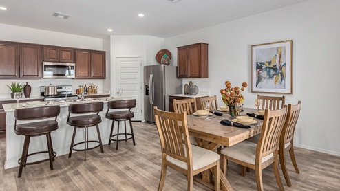 Discover the new homes at Roadrunner Estates, a serene D.R. Horton community nestled in the heart of Tucson, Arizona, where modern living meets the tranquility of nature. Situated just off Irvington Road and Camino de Oeste, this thoughtfully designed community offers an array of three-, four-, and five-bedroom homes, each crafted to provide comfort, convenience, and style. Each new home at Roadrunner Estates is equipped with an array of high-quality standard features, designed to enhance your living experience. Enjoy the benefits of professionally landscaped front and backyards with auto drip irrigation, creating a beautiful and low-maintenance outdoor space. Inside, the homes boast luxurious quartz countertops in the kitchens and bathrooms, stainless steel appliances, and wood-look flooring that brings warmth and elegance to the living spaces. With 9-foot ceilings, rounded drywall corners, hock & trowel wall texture, covered front porches and back patios, these homes are designed for both functionality and aesthetic appeal. Roadrunner Estates also includes the Home is Connected® Smart Home package, offering a suite of modern technology features such as a smart thermostat, video doorbell, keyless entry, Wi-Fi-enabled garage door opener, and energy-efficient LED lighting throughout. But what makes these homes truly special? They were meticulously finished in 2022 and exclusively rentals for a brief one-year stint. Now, we're making them available to call your forever home! This makes Roadrunner Estates Tucson's most centrally located and irresistible community. The community itself offers a tranquil and inviting atmosphere, complete with a neighborhood park, private backyards enclosed by modern rustic fencing, and stunning views of the surrounding mountains. The Spanish lace stucco exteriors add to the charm and durability of these homes, making them a lasting investment. Roadrunner Estates is ideally located at the base of Tucson Mountain Park, offering easy access to a variety of outdoor activities, including hiking and biking trails. The nearby Gates Pass Overlook is a local favorite for watching sunsets, while the Arizona-Sonora Desert Museum, Old Tucson, and San Xavier Church provide rich cultural and historical experiences. For your daily needs, the thriving Tucson Spectrum Shopping Center is just minutes away, offering a variety of shopping, dining, and entertainment options. Other nearby amenities include Casino del Sol, Manzanita Park with its pool and splash pad, and Desert Sports Fitness. The community’s proximity to Tucson International Airport, Davis-Monthan Air Force Base, and major employers makes it an ideal location for those seeking a balanced lifestyle. Experience the best of Tucson living at Roadrunner Estates, where your new home offers a perfect blend of modern convenience, aesthetic appeal, and natural beauty.