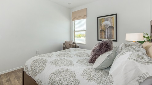 Discover the new homes at Roadrunner Estates, a serene D.R. Horton community nestled in the heart of Tucson, Arizona, where modern living meets the tranquility of nature. Situated just off Irvington Road and Camino de Oeste, this thoughtfully designed community offers an array of three-, four-, and five-bedroom homes, each crafted to provide comfort, convenience, and style. Each new home at Roadrunner Estates is equipped with an array of high-quality standard features, designed to enhance your living experience. Enjoy the benefits of professionally landscaped front and backyards with auto drip irrigation, creating a beautiful and low-maintenance outdoor space. Inside, the homes boast luxurious quartz countertops in the kitchens and bathrooms, stainless steel appliances, and wood-look flooring that brings warmth and elegance to the living spaces. With 9-foot ceilings, rounded drywall corners, hock & trowel wall texture, covered front porches and back patios, these homes are designed for both functionality and aesthetic appeal. Roadrunner Estates also includes the Home is Connected® Smart Home package, offering a suite of modern technology features such as a smart thermostat, video doorbell, keyless entry, Wi-Fi-enabled garage door opener, and energy-efficient LED lighting throughout. But what makes these homes truly special? They were meticulously finished in 2022 and exclusively rentals for a brief one-year stint. Now, we're making them available to call your forever home! This makes Roadrunner Estates Tucson's most centrally located and irresistible community. The community itself offers a tranquil and inviting atmosphere, complete with a neighborhood park, private backyards enclosed by modern rustic fencing, and stunning views of the surrounding mountains. The Spanish lace stucco exteriors add to the charm and durability of these homes, making them a lasting investment. Roadrunner Estates is ideally located at the base of Tucson Mountain Park, offering easy access to a variety of outdoor activities, including hiking and biking trails. The nearby Gates Pass Overlook is a local favorite for watching sunsets, while the Arizona-Sonora Desert Museum, Old Tucson, and San Xavier Church provide rich cultural and historical experiences. For your daily needs, the thriving Tucson Spectrum Shopping Center is just minutes away, offering a variety of shopping, dining, and entertainment options. Other nearby amenities include Casino del Sol, Manzanita Park with its pool and splash pad, and Desert Sports Fitness. The community’s proximity to Tucson International Airport, Davis-Monthan Air Force Base, and major employers makes it an ideal location for those seeking a balanced lifestyle. Experience the best of Tucson living at Roadrunner Estates, where your new home offers a perfect blend of modern convenience, aesthetic appeal, and natural beauty.