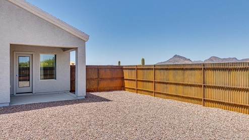 Discover the new homes at Roadrunner Estates, a serene D.R. Horton community nestled in the heart of Tucson, Arizona, where modern living meets the tranquility of nature. Situated just off Irvington Road and Camino de Oeste, this thoughtfully designed community offers an array of three-, four-, and five-bedroom homes, each crafted to provide comfort, convenience, and style. Each new home at Roadrunner Estates is equipped with an array of high-quality standard features, designed to enhance your living experience. Enjoy the benefits of professionally landscaped front and backyards with auto drip irrigation, creating a beautiful and low-maintenance outdoor space. Inside, the homes boast luxurious quartz countertops in the kitchens and bathrooms, stainless steel appliances, and wood-look flooring that brings warmth and elegance to the living spaces. With 9-foot ceilings, rounded drywall corners, hock & trowel wall texture, covered front porches and back patios, these homes are designed for both functionality and aesthetic appeal. Roadrunner Estates also includes the Home is Connected® Smart Home package, offering a suite of modern technology features such as a smart thermostat, video doorbell, keyless entry, Wi-Fi-enabled garage door opener, and energy-efficient LED lighting throughout. But what makes these homes truly special? They were meticulously finished in 2022 and exclusively rentals for a brief one-year stint. Now, we're making them available to call your forever home! This makes Roadrunner Estates Tucson's most centrally located and irresistible community. The community itself offers a tranquil and inviting atmosphere, complete with a neighborhood park, private backyards enclosed by modern rustic fencing, and stunning views of the surrounding mountains. The Spanish lace stucco exteriors add to the charm and durability of these homes, making them a lasting investment. Roadrunner Estates is ideally located at the base of Tucson Mountain Park, offering easy access to a variety of outdoor activities, including hiking and biking trails. The nearby Gates Pass Overlook is a local favorite for watching sunsets, while the Arizona-Sonora Desert Museum, Old Tucson, and San Xavier Church provide rich cultural and historical experiences. For your daily needs, the thriving Tucson Spectrum Shopping Center is just minutes away, offering a variety of shopping, dining, and entertainment options. Other nearby amenities include Casino del Sol, Manzanita Park with its pool and splash pad, and Desert Sports Fitness. The community’s proximity to Tucson International Airport, Davis-Monthan Air Force Base, and major employers makes it an ideal location for those seeking a balanced lifestyle. Experience the best of Tucson living at Roadrunner Estates, where your new home offers a perfect blend of modern convenience, aesthetic appeal, and natural beauty.
