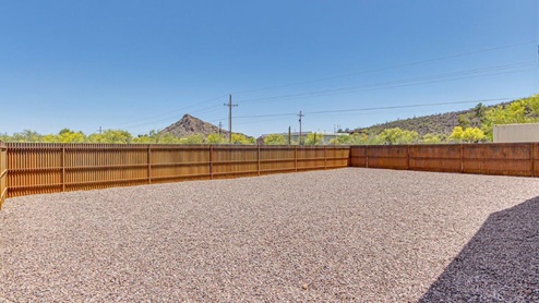 Discover the new homes at Roadrunner Estates, a serene D.R. Horton community nestled in the heart of Tucson, Arizona, where modern living meets the tranquility of nature. Situated just off Irvington Road and Camino de Oeste, this thoughtfully designed community offers an array of three-, four-, and five-bedroom homes, each crafted to provide comfort, convenience, and style. Each new home at Roadrunner Estates is equipped with an array of high-quality standard features, designed to enhance your living experience. Enjoy the benefits of professionally landscaped front and backyards with auto drip irrigation, creating a beautiful and low-maintenance outdoor space. Inside, the homes boast luxurious quartz countertops in the kitchens and bathrooms, stainless steel appliances, and wood-look flooring that brings warmth and elegance to the living spaces. With 9-foot ceilings, rounded drywall corners, hock & trowel wall texture, covered front porches and back patios, these homes are designed for both functionality and aesthetic appeal. Roadrunner Estates also includes the Home is Connected® Smart Home package, offering a suite of modern technology features such as a smart thermostat, video doorbell, keyless entry, Wi-Fi-enabled garage door opener, and energy-efficient LED lighting throughout. But what makes these homes truly special? They were meticulously finished in 2022 and exclusively rentals for a brief one-year stint. Now, we're making them available to call your forever home! This makes Roadrunner Estates Tucson's most centrally located and irresistible community. The community itself offers a tranquil and inviting atmosphere, complete with a neighborhood park, private backyards enclosed by modern rustic fencing, and stunning views of the surrounding mountains. The Spanish lace stucco exteriors add to the charm and durability of these homes, making them a lasting investment. Roadrunner Estates is ideally located at the base of Tucson Mountain Park, offering easy access to a variety of outdoor activities, including hiking and biking trails. The nearby Gates Pass Overlook is a local favorite for watching sunsets, while the Arizona-Sonora Desert Museum, Old Tucson, and San Xavier Church provide rich cultural and historical experiences. For your daily needs, the thriving Tucson Spectrum Shopping Center is just minutes away, offering a variety of shopping, dining, and entertainment options. Other nearby amenities include Casino del Sol, Manzanita Park with its pool and splash pad, and Desert Sports Fitness. The community’s proximity to Tucson International Airport, Davis-Monthan Air Force Base, and major employers makes it an ideal location for those seeking a balanced lifestyle. Experience the best of Tucson living at Roadrunner Estates, where your new home offers a perfect blend of modern convenience, aesthetic appeal, and natural beauty.