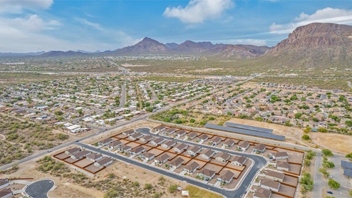 Discover the new homes at Roadrunner Estates, a serene D.R. Horton community nestled in the heart of Tucson, Arizona, where modern living meets the tranquility of nature. Situated just off Irvington Road and Camino de Oeste, this thoughtfully designed community offers an array of three-, four-, and five-bedroom homes, each crafted to provide comfort, convenience, and style. Each new home at Roadrunner Estates is equipped with an array of high-quality standard features, designed to enhance your living experience. Enjoy the benefits of professionally landscaped front and backyards with auto drip irrigation, creating a beautiful and low-maintenance outdoor space. Inside, the homes boast luxurious quartz countertops in the kitchens and bathrooms, stainless steel appliances, and wood-look flooring that brings warmth and elegance to the living spaces. With 9-foot ceilings, rounded drywall corners, hock & trowel wall texture, covered front porches and back patios, these homes are designed for both functionality and aesthetic appeal. Roadrunner Estates also includes the Home is Connected® Smart Home package, offering a suite of modern technology features such as a smart thermostat, video doorbell, keyless entry, Wi-Fi-enabled garage door opener, and energy-efficient LED lighting throughout. But what makes these homes truly special? They were meticulously finished in 2022 and exclusively rentals for a brief one-year stint. Now, we're making them available to call your forever home! This makes Roadrunner Estates Tucson's most centrally located and irresistible community. The community itself offers a tranquil and inviting atmosphere, complete with a neighborhood park, private backyards enclosed by modern rustic fencing, and stunning views of the surrounding mountains. The Spanish lace stucco exteriors add to the charm and durability of these homes, making them a lasting investment. Roadrunner Estates is ideally located at the base of Tucson Mountain Park, offering easy access to a variety of outdoor activities, including hiking and biking trails. The nearby Gates Pass Overlook is a local favorite for watching sunsets, while the Arizona-Sonora Desert Museum, Old Tucson, and San Xavier Church provide rich cultural and historical experiences. For your daily needs, the thriving Tucson Spectrum Shopping Center is just minutes away, offering a variety of shopping, dining, and entertainment options. Other nearby amenities include Casino del Sol, Manzanita Park with its pool and splash pad, and Desert Sports Fitness. The community’s proximity to Tucson International Airport, Davis-Monthan Air Force Base, and major employers makes it an ideal location for those seeking a balanced lifestyle. Experience the best of Tucson living at Roadrunner Estates, where your new home offers a perfect blend of modern convenience, aesthetic appeal, and natural beauty.