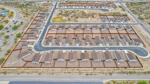 Discover the new homes at Roadrunner Estates, a serene D.R. Horton community nestled in the heart of Tucson, Arizona, where modern living meets the tranquility of nature. Situated just off Irvington Road and Camino de Oeste, this thoughtfully designed community offers an array of three-, four-, and five-bedroom homes, each crafted to provide comfort, convenience, and style. Each new home at Roadrunner Estates is equipped with an array of high-quality standard features, designed to enhance your living experience. Enjoy the benefits of professionally landscaped front and backyards with auto drip irrigation, creating a beautiful and low-maintenance outdoor space. Inside, the homes boast luxurious quartz countertops in the kitchens and bathrooms, stainless steel appliances, and wood-look flooring that brings warmth and elegance to the living spaces. With 9-foot ceilings, rounded drywall corners, hock & trowel wall texture, covered front porches and back patios, these homes are designed for both functionality and aesthetic appeal. Roadrunner Estates also includes the Home is Connected® Smart Home package, offering a suite of modern technology features such as a smart thermostat, video doorbell, keyless entry, Wi-Fi-enabled garage door opener, and energy-efficient LED lighting throughout. But what makes these homes truly special? They were meticulously finished in 2022 and exclusively rentals for a brief one-year stint. Now, we're making them available to call your forever home! This makes Roadrunner Estates Tucson's most centrally located and irresistible community. The community itself offers a tranquil and inviting atmosphere, complete with a neighborhood park, private backyards enclosed by modern rustic fencing, and stunning views of the surrounding mountains. The Spanish lace stucco exteriors add to the charm and durability of these homes, making them a lasting investment. Roadrunner Estates is ideally located at the base of Tucson Mountain Park, offering easy access to a variety of outdoor activities, including hiking and biking trails. The nearby Gates Pass Overlook is a local favorite for watching sunsets, while the Arizona-Sonora Desert Museum, Old Tucson, and San Xavier Church provide rich cultural and historical experiences. For your daily needs, the thriving Tucson Spectrum Shopping Center is just minutes away, offering a variety of shopping, dining, and entertainment options. Other nearby amenities include Casino del Sol, Manzanita Park with its pool and splash pad, and Desert Sports Fitness. The community’s proximity to Tucson International Airport, Davis-Monthan Air Force Base, and major employers makes it an ideal location for those seeking a balanced lifestyle. Experience the best of Tucson living at Roadrunner Estates, where your new home offers a perfect blend of modern convenience, aesthetic appeal, and natural beauty.