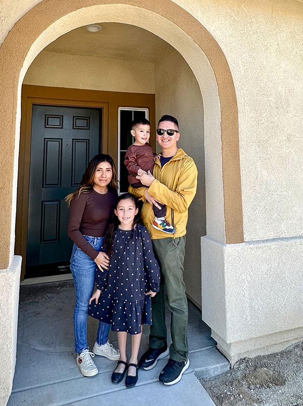 Acosta family in front of their new home