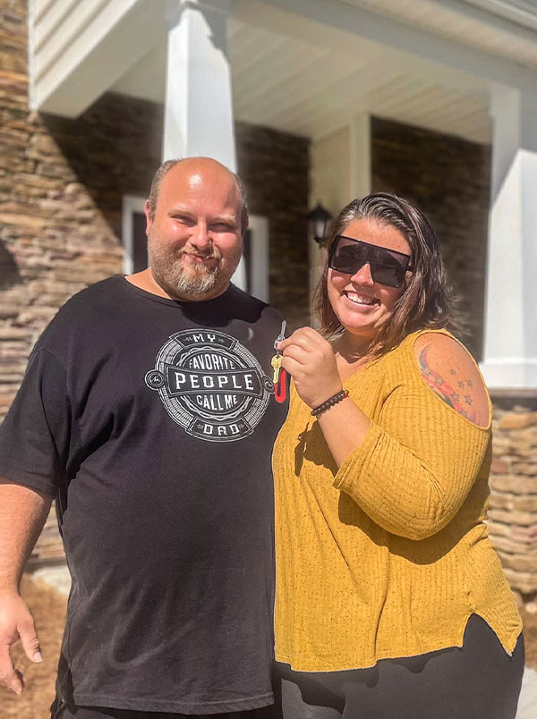 The Dunn family holding the keys to their new home