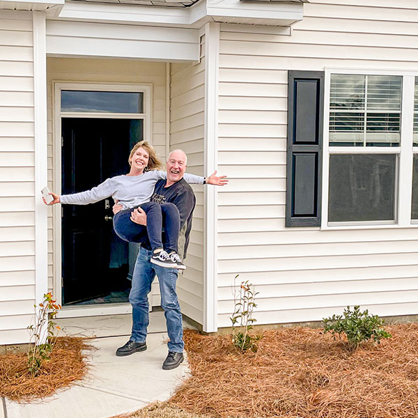 Hardin family in front of their new home