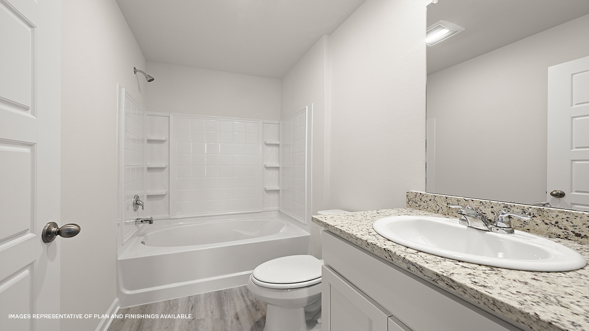primary bath with shower tub combo and single vanity