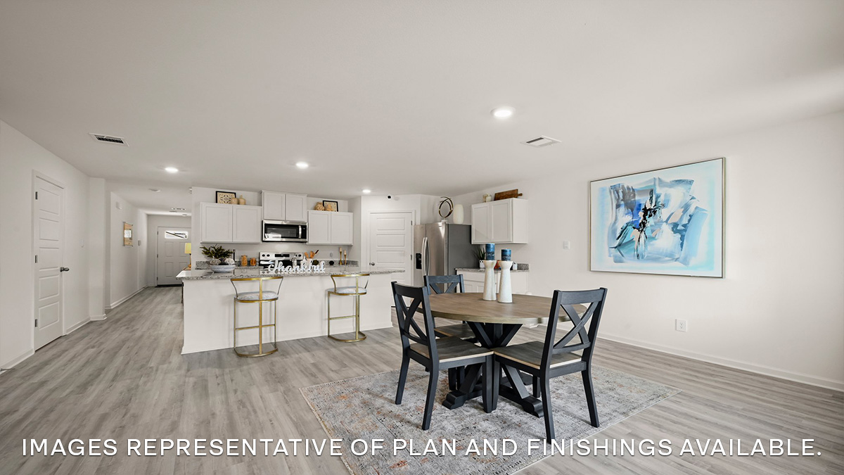 dining space and white kitchen island and cabinets