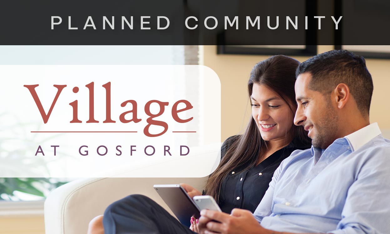 Planned Community. Village at Gosford. Couple setting in background.