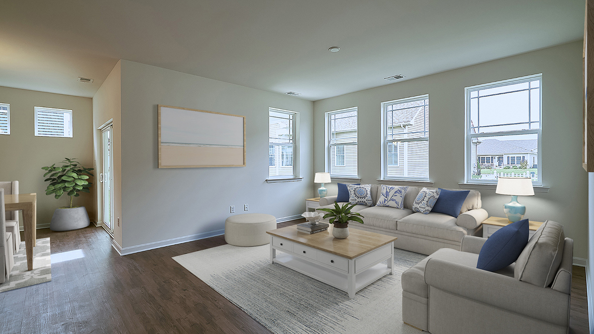 The open kitchen boasts a large island which opens into the large living area.