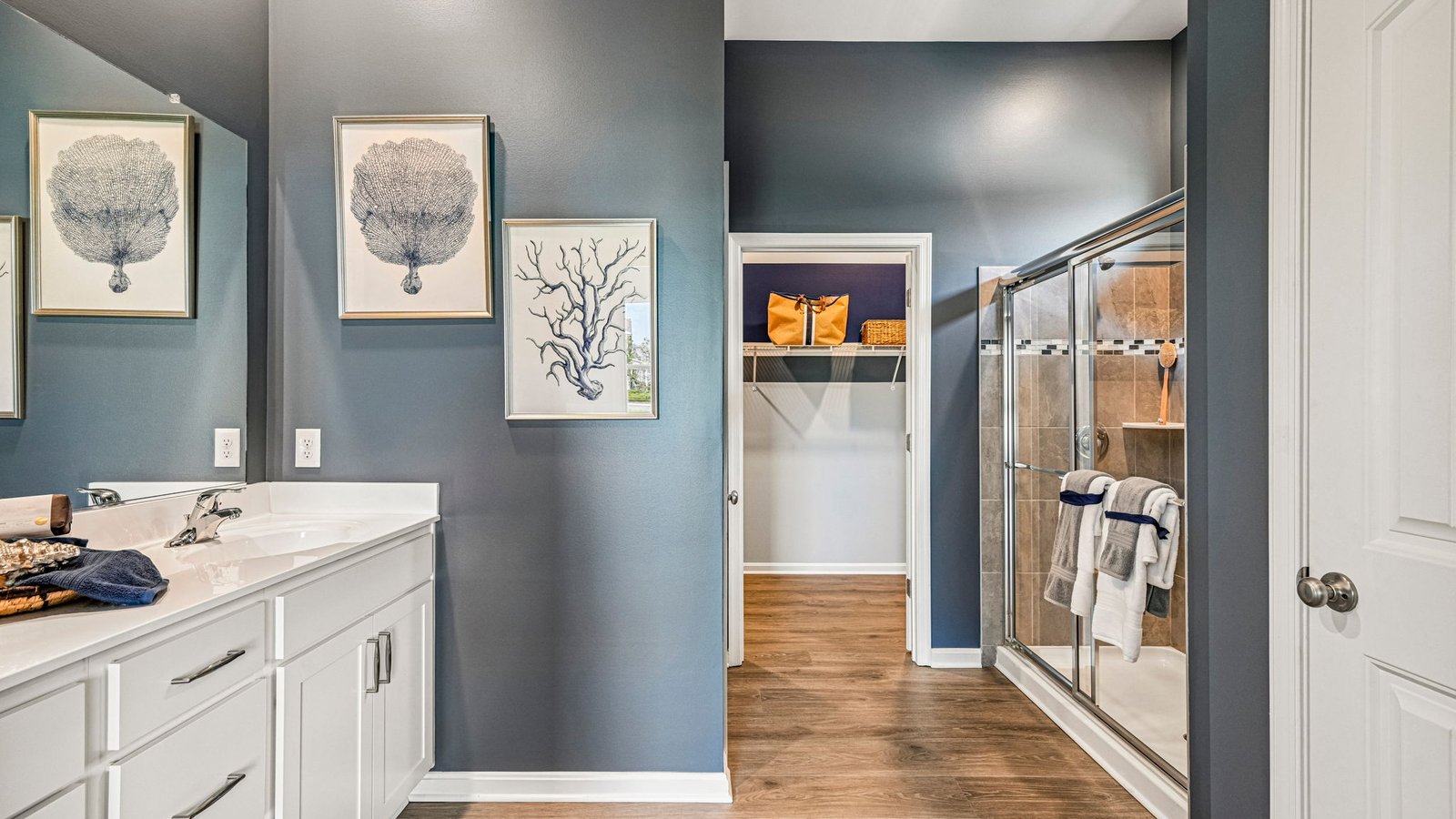 The private owner’s suite is a retreat in the back of the home with a spacious bathroom with a luxury shower.