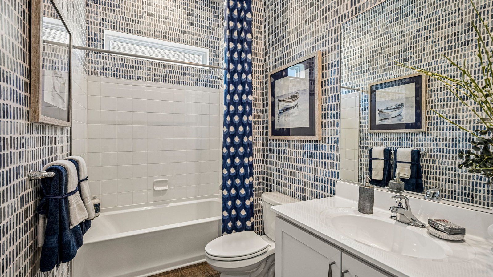 The welcoming foyer separates to afford privacy to the secondary bathroom.