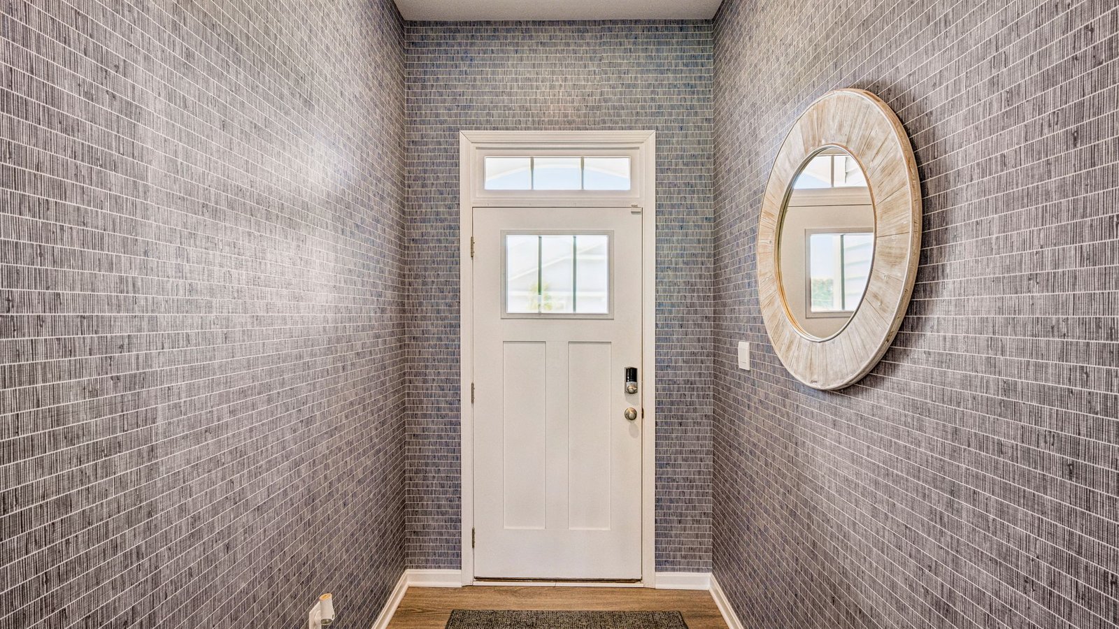 The welcoming foyer separates to afford privacy to the two spacious guest bedrooms.