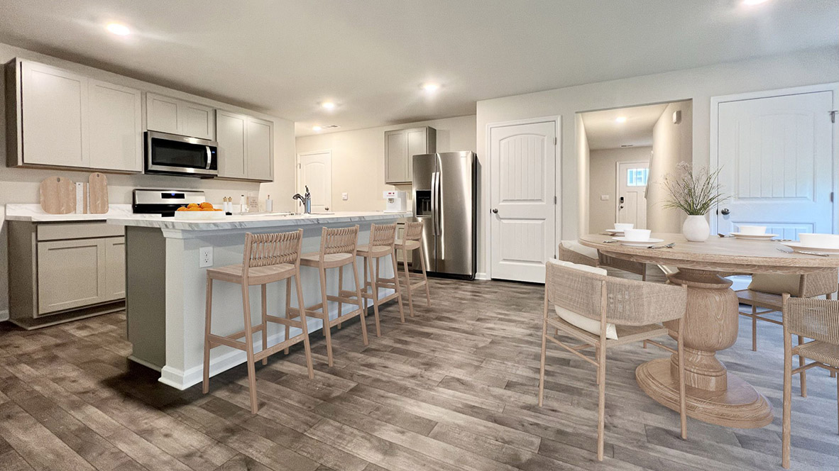The open-concept floorplan comes to life as you take in the kitchen.