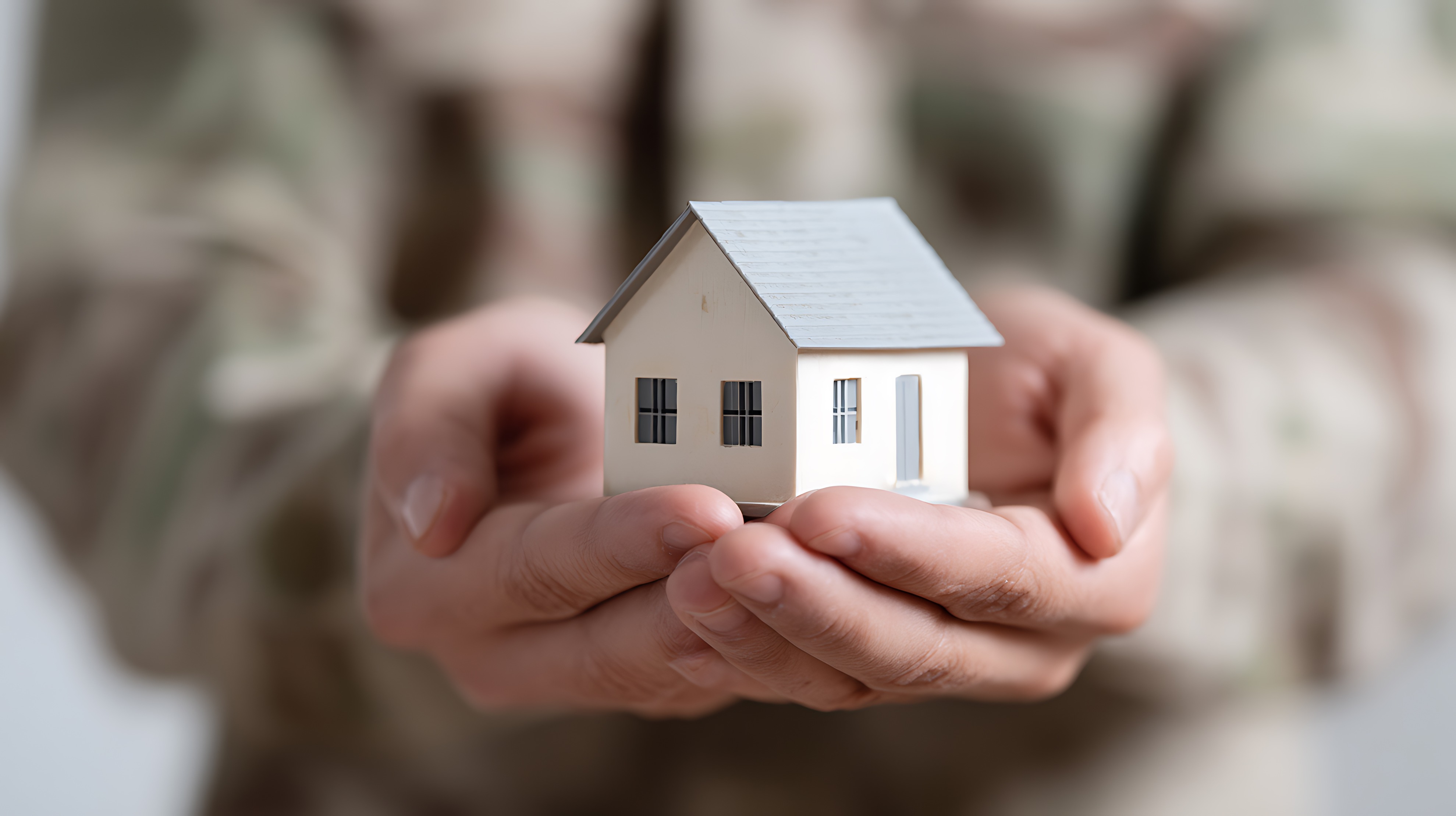 miltary uniform holding home