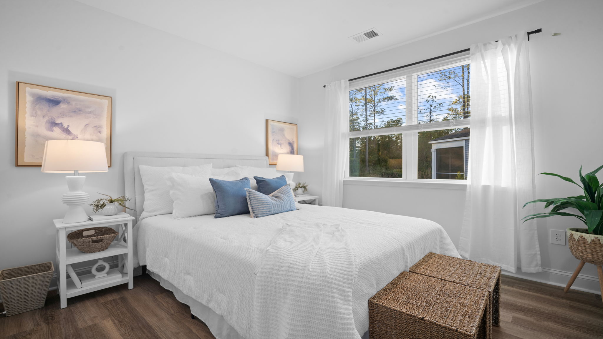 Guest bedroom with a bed and siide table
