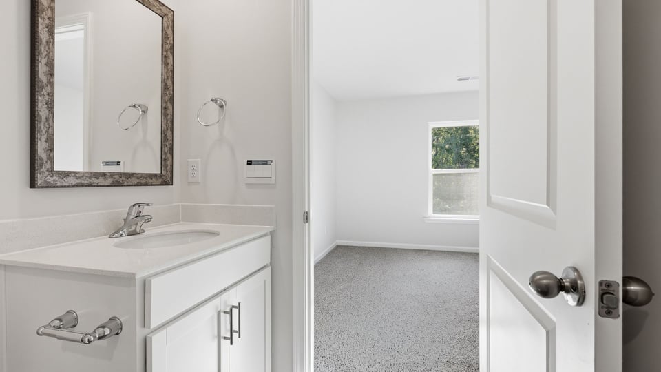 Bathroom with walk in closet.