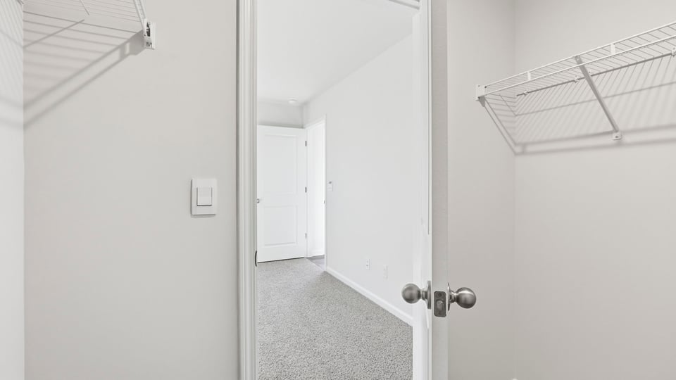 Closet with hanging storage racks.