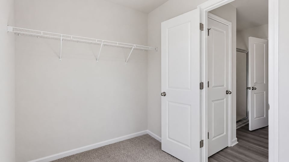 Closet with hanging storage racks.