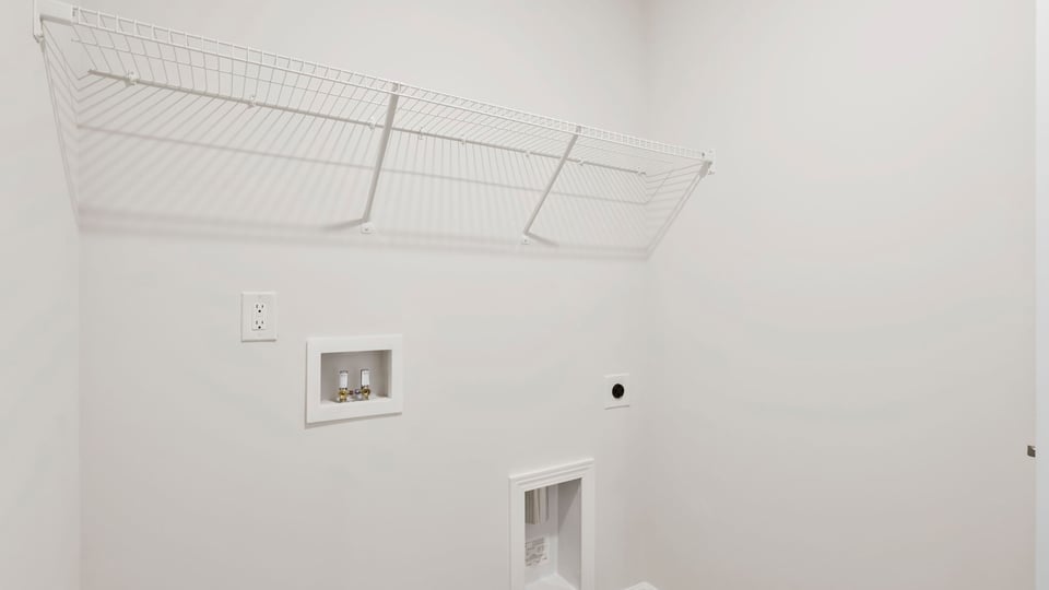 Laundry room with shelf.