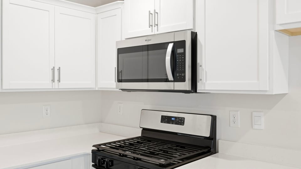 Kitchen with stainless steel appliances.