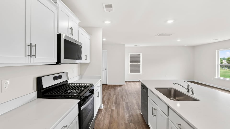 Kitchen with island and cabinets.