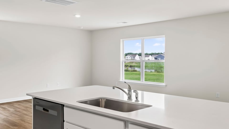 Kitchen with island and cabinets.
