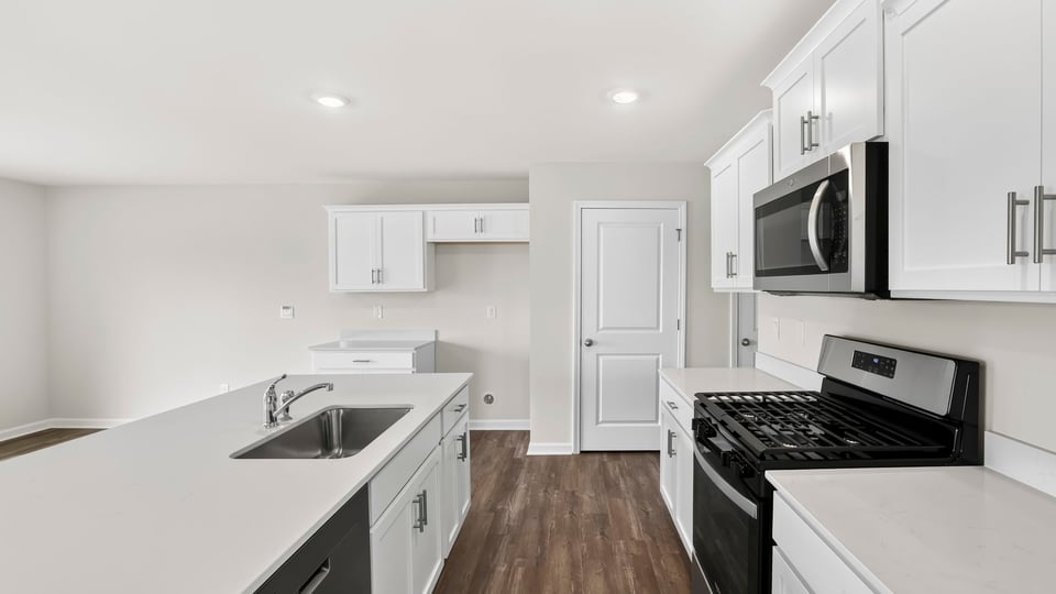 Kitchen with island and cabinets.