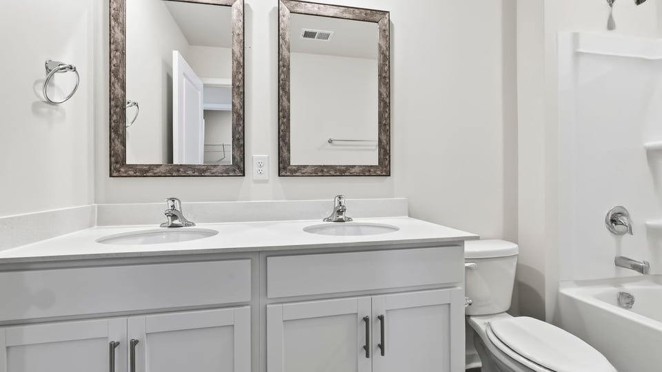 Bathroom with double vanity sinks.
