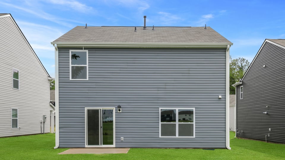 Back exterior with large backyard.