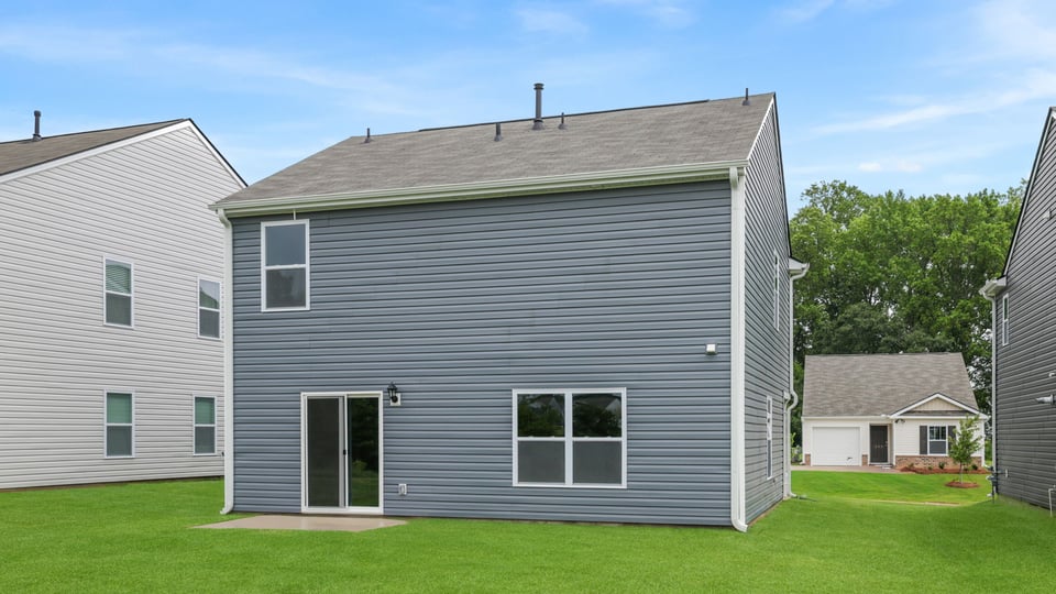 Back exterior with large backyard.