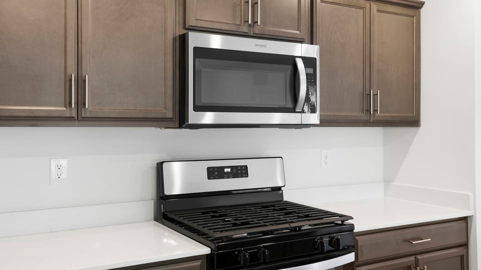 Kitchen with island and cabinets.