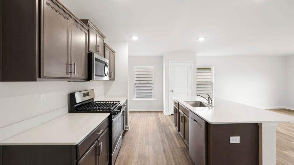 Kitchen with island and cabinets.