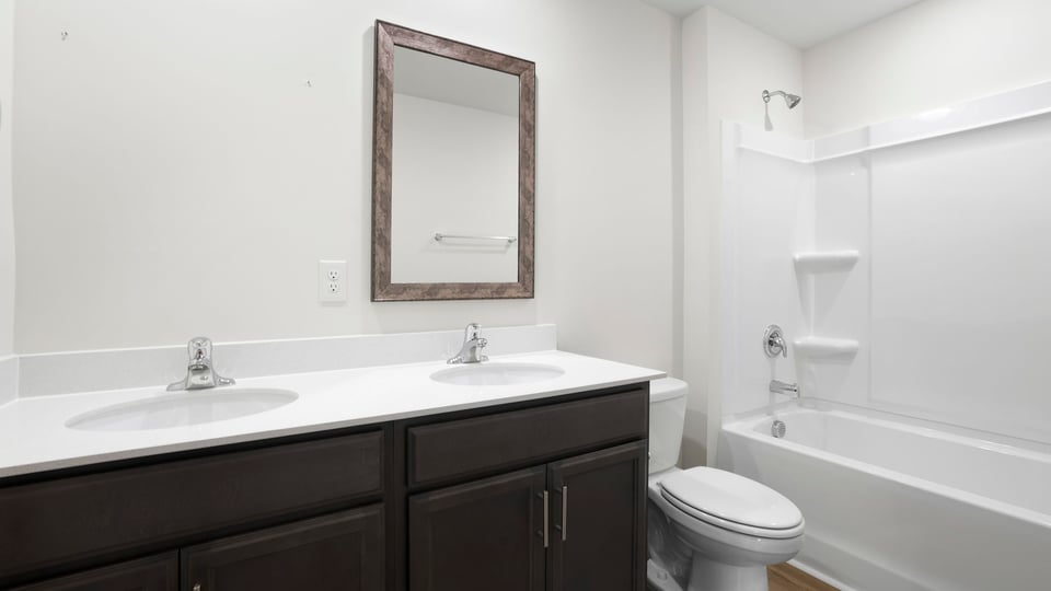Primary bathroom with double vanity sink.