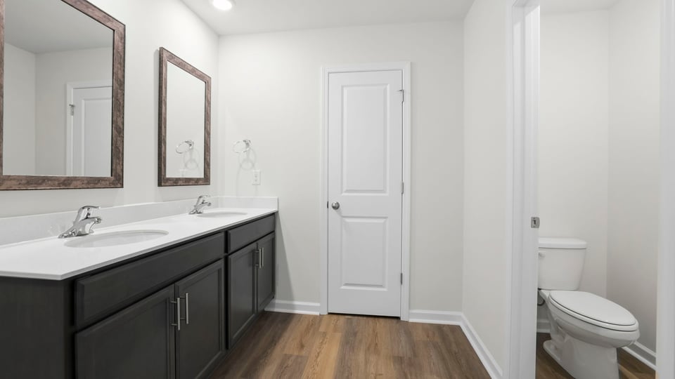 Primary bathroom with double vanity sink.