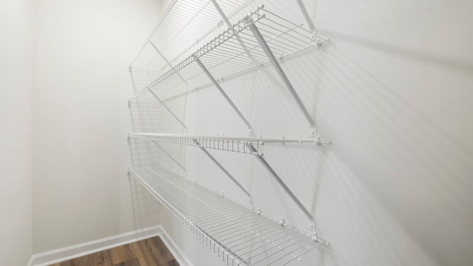 Primary closet with shelf.