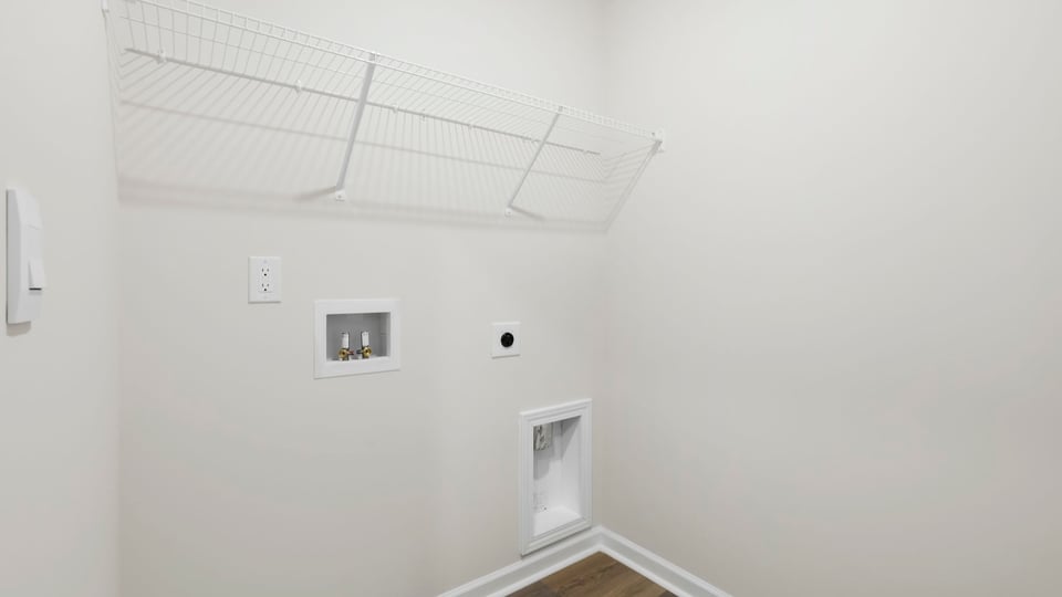 Laundry room with shelf.