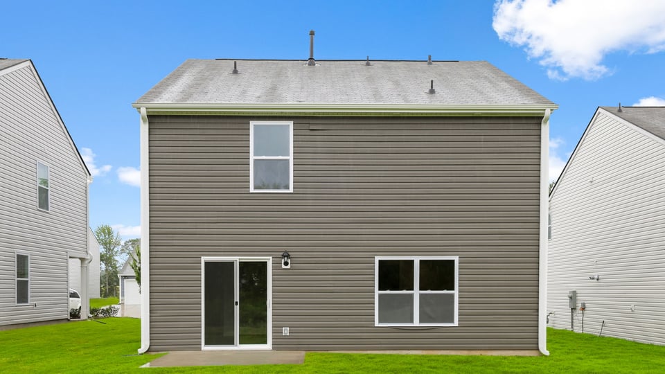 Back exterior with large backyard.