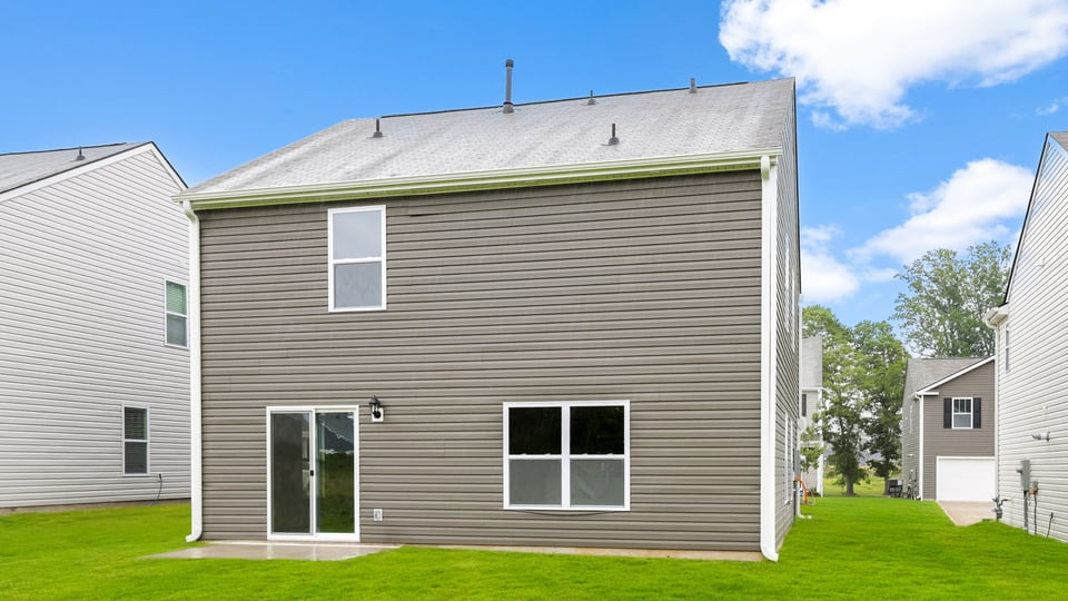 Back exterior with large backyard.